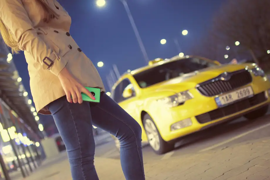 girl cell phone taxi arriving